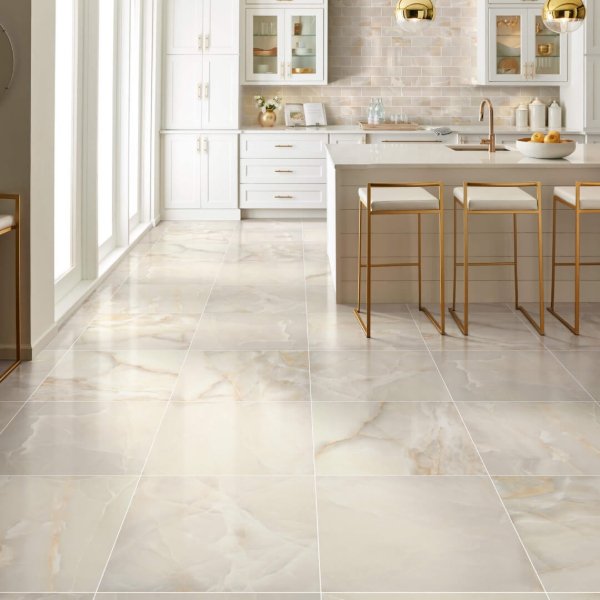 Modern kitchen with marble tile flooring and gold accents