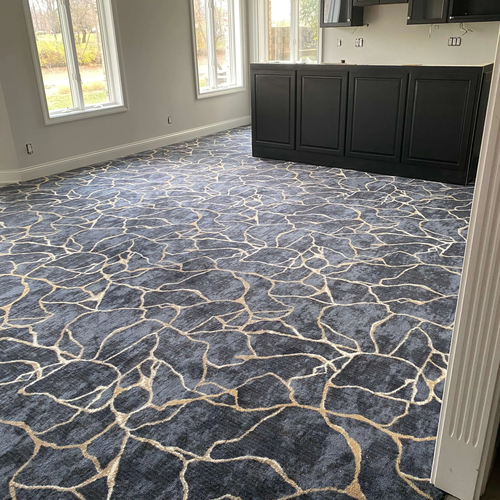 Patterned gold and navy blue carpet flooring