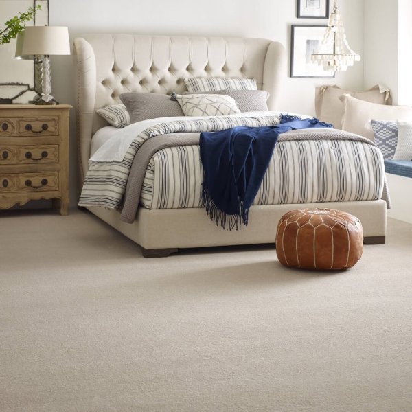 Carmel, IN home with soft carpet floors in a cozy bedroom